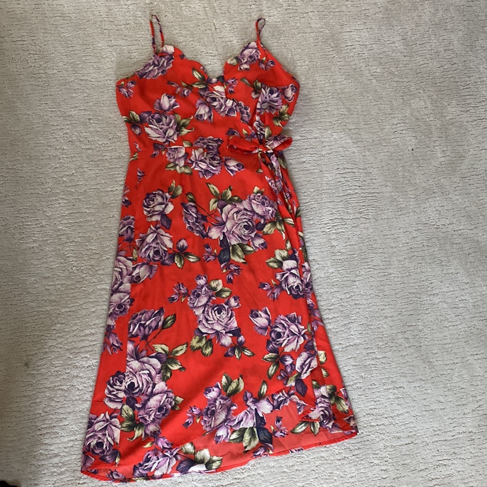 Sweet, flattering wrap dress.  Inside butting makes sure it stays closed.